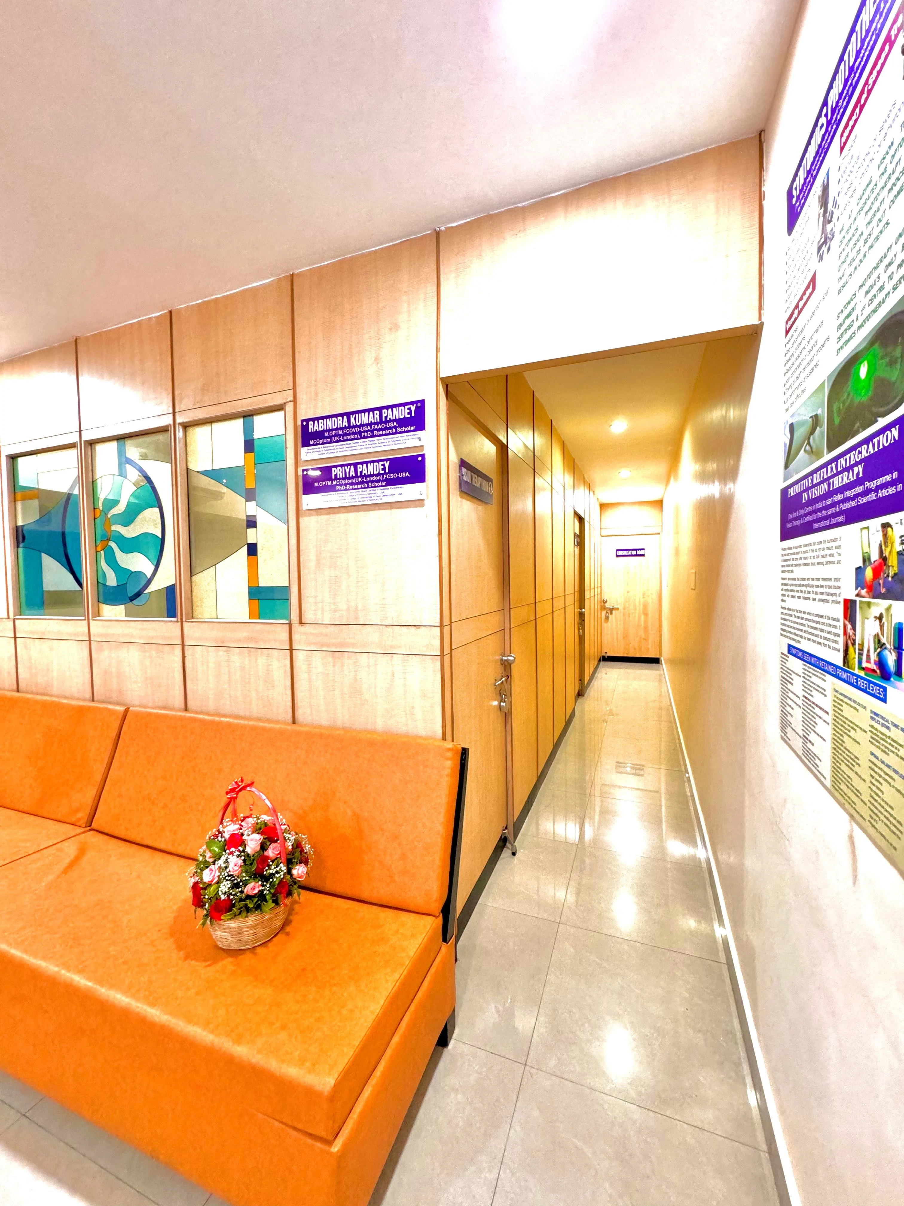 Caring Vision Therapy Anna Nagar Chennai – Clinic corridor with waiting sofa leading to therapy and consultation rooms