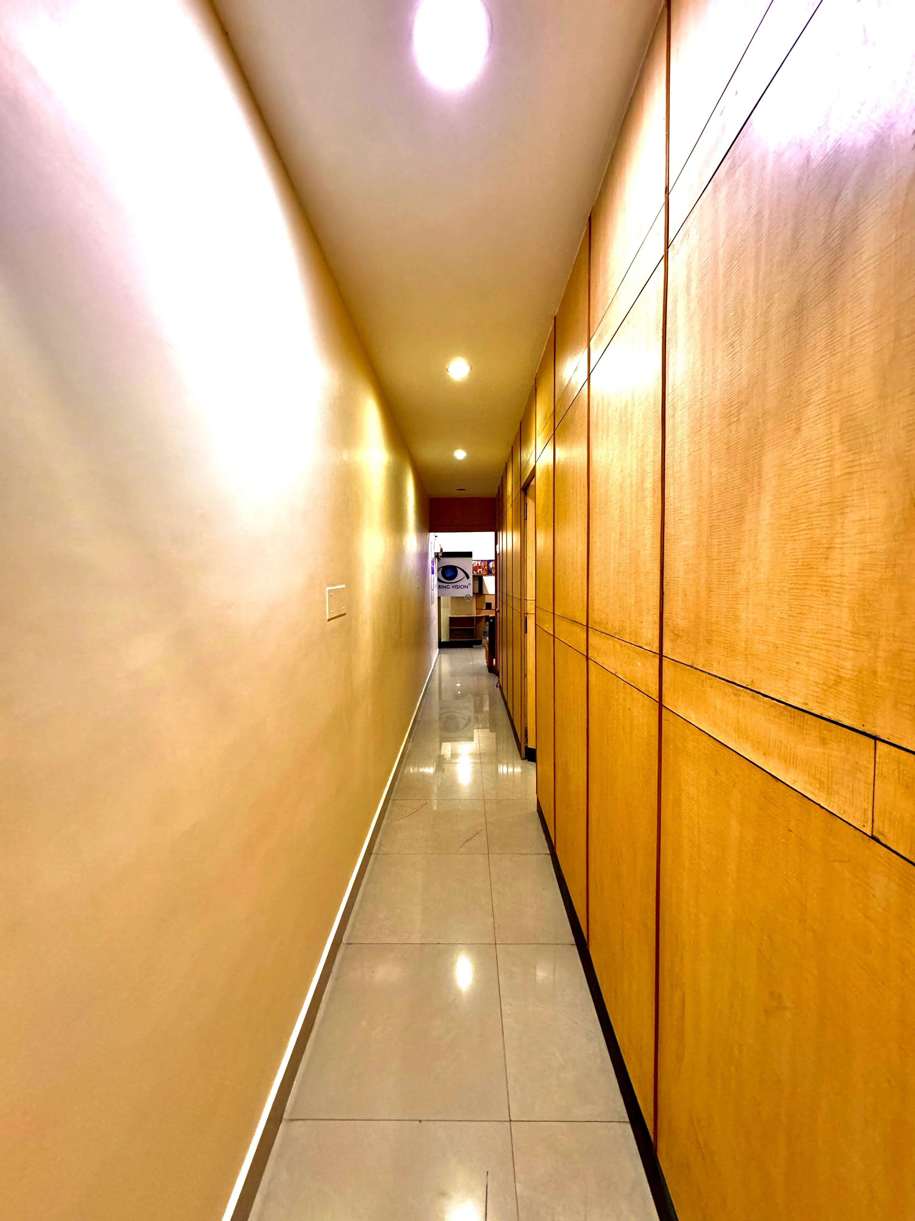 Caring Vision Therapy Anna Nagar Chennai – Internal clinic hallway connecting consultation and therapy rooms