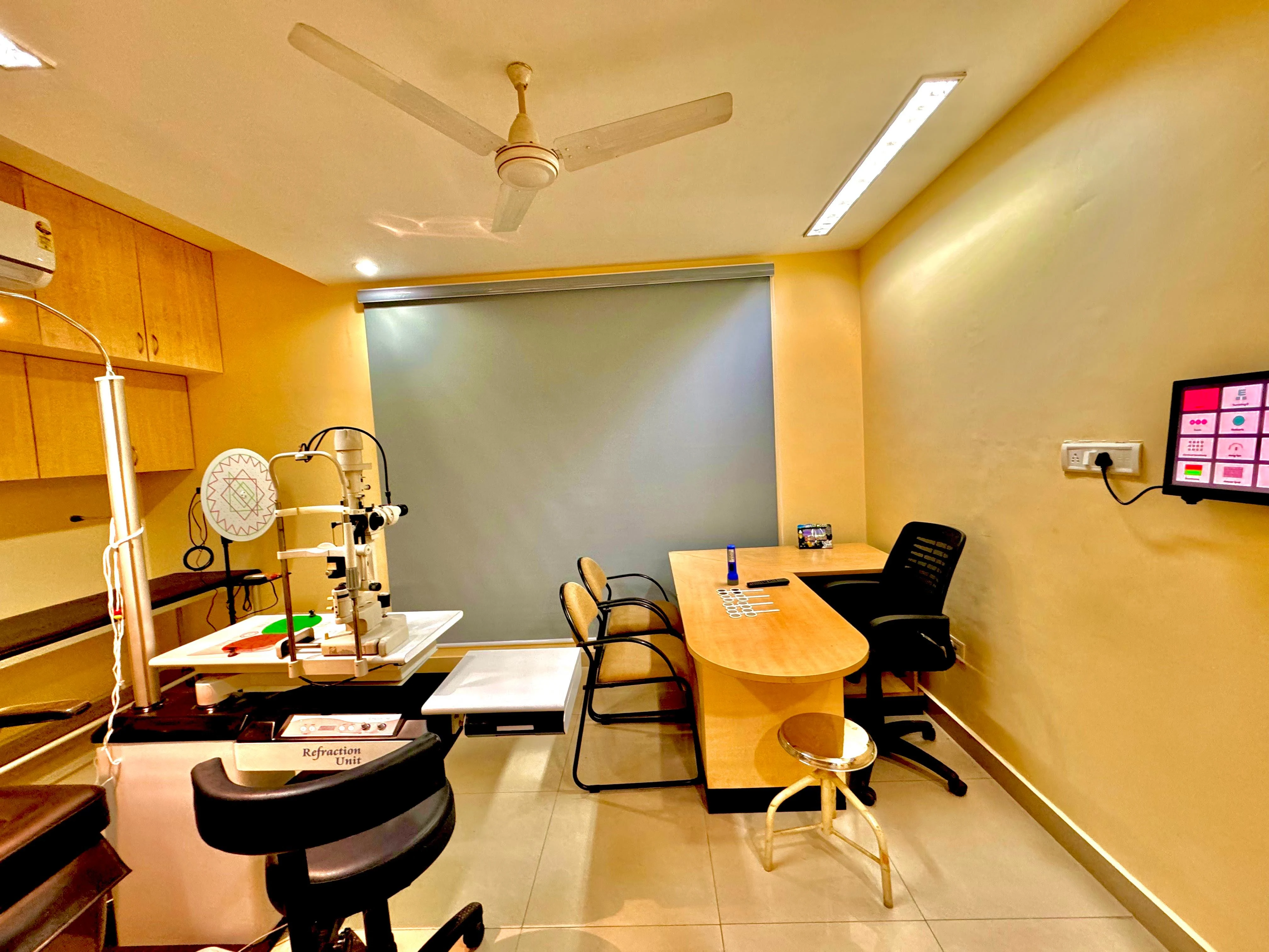Caring Vision Therapy Anna Nagar Chennai – Refraction room with refraction unit, slit lamp and examination setup