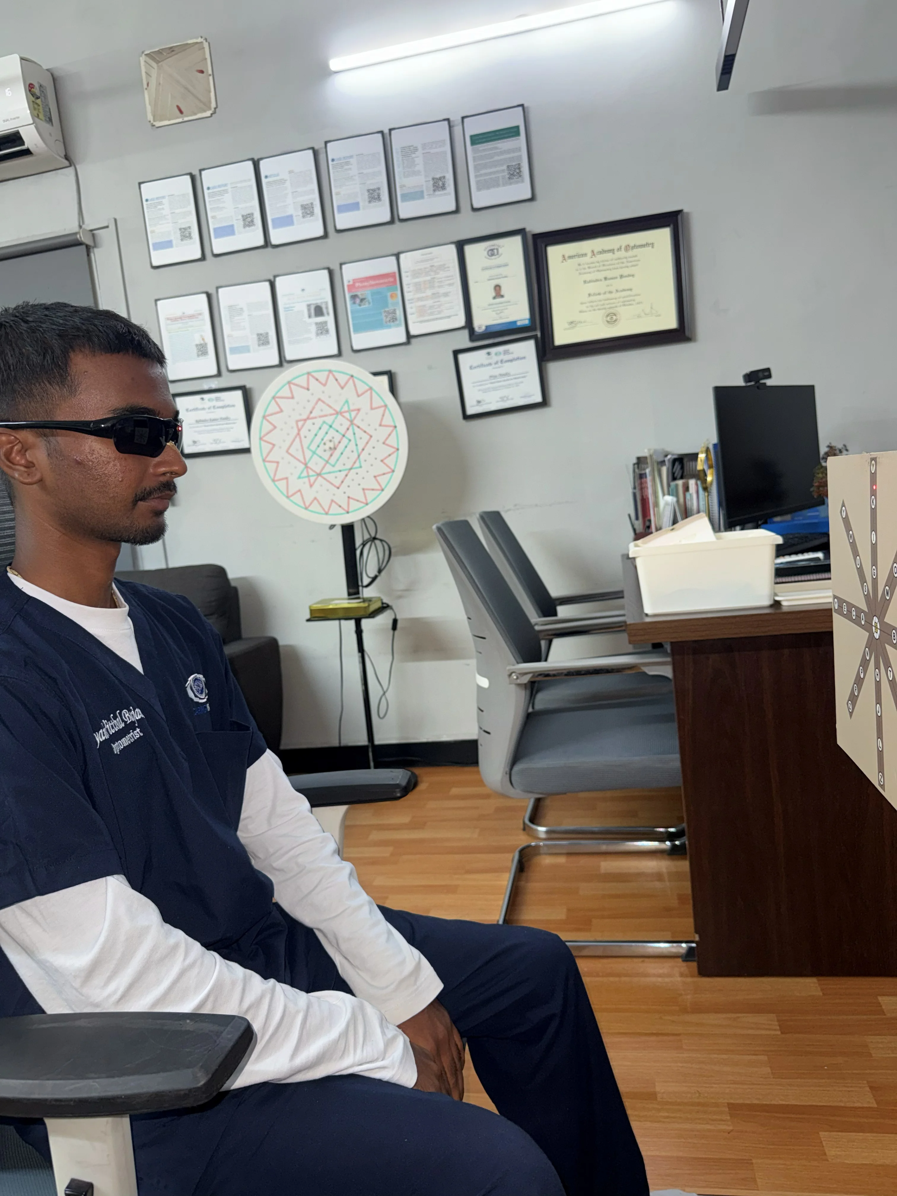 Caring Vision Therapy Ashok Nagar Chennai - Patient wearing red-green anaglyph glasses during suppression test
