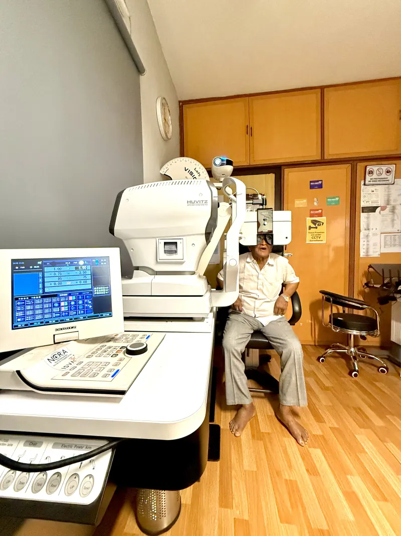 Caring Vision Therapy Ashok Nagar Chennai - Patient undergoing HUVITZ auto-refractor eye examination