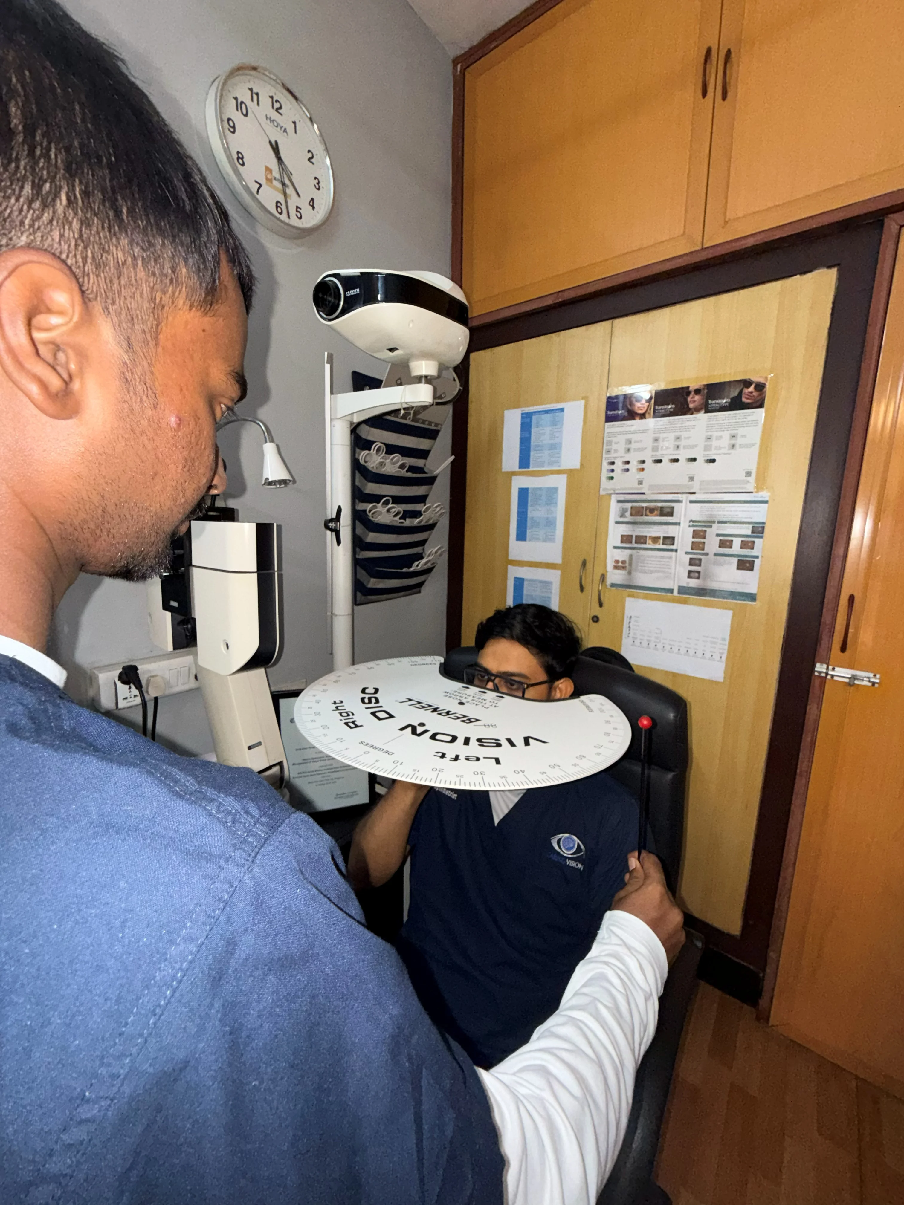 Caring Vision Therapy Ashok Nagar Chennai - Patient holding Caring Vision branded disc during clinic visit