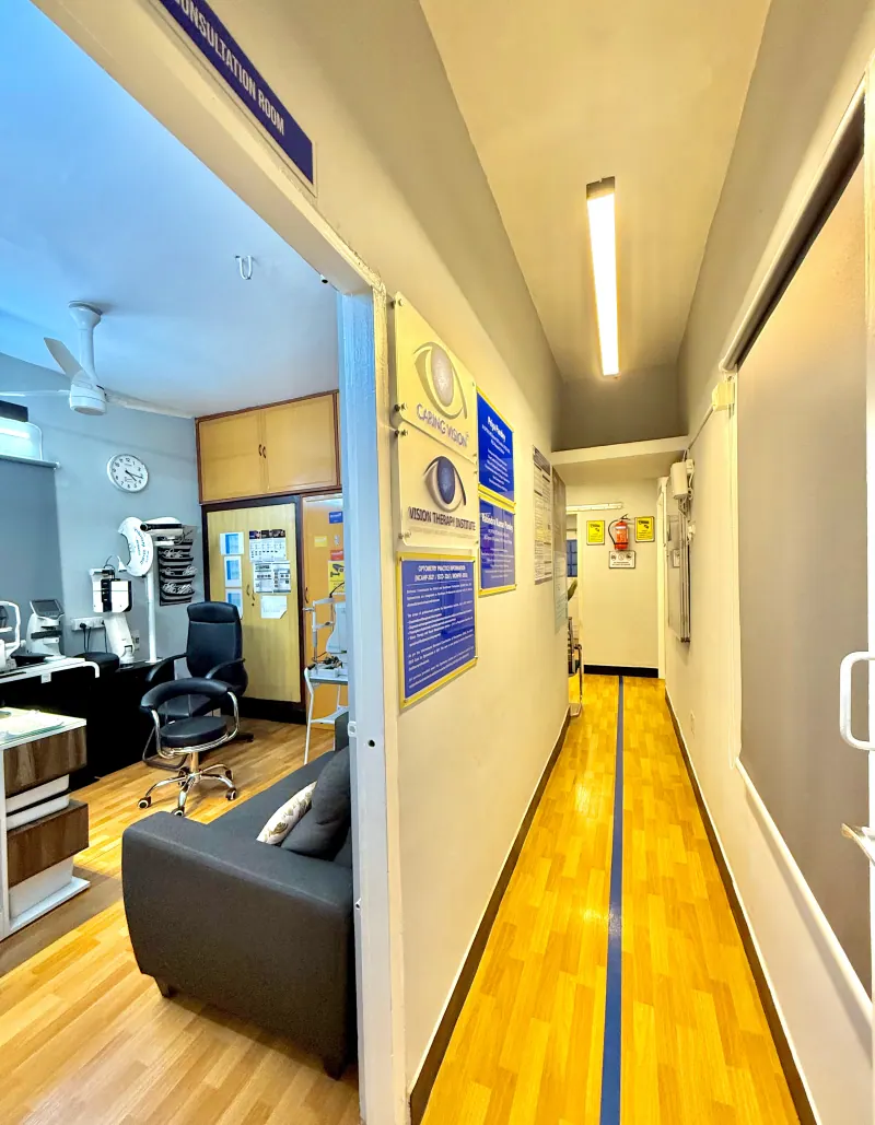 Caring Vision Therapy Ashok Nagar Chennai - Clinic corridor showing Consultation Room sign, Vision Therapy Institute of India board and hallway