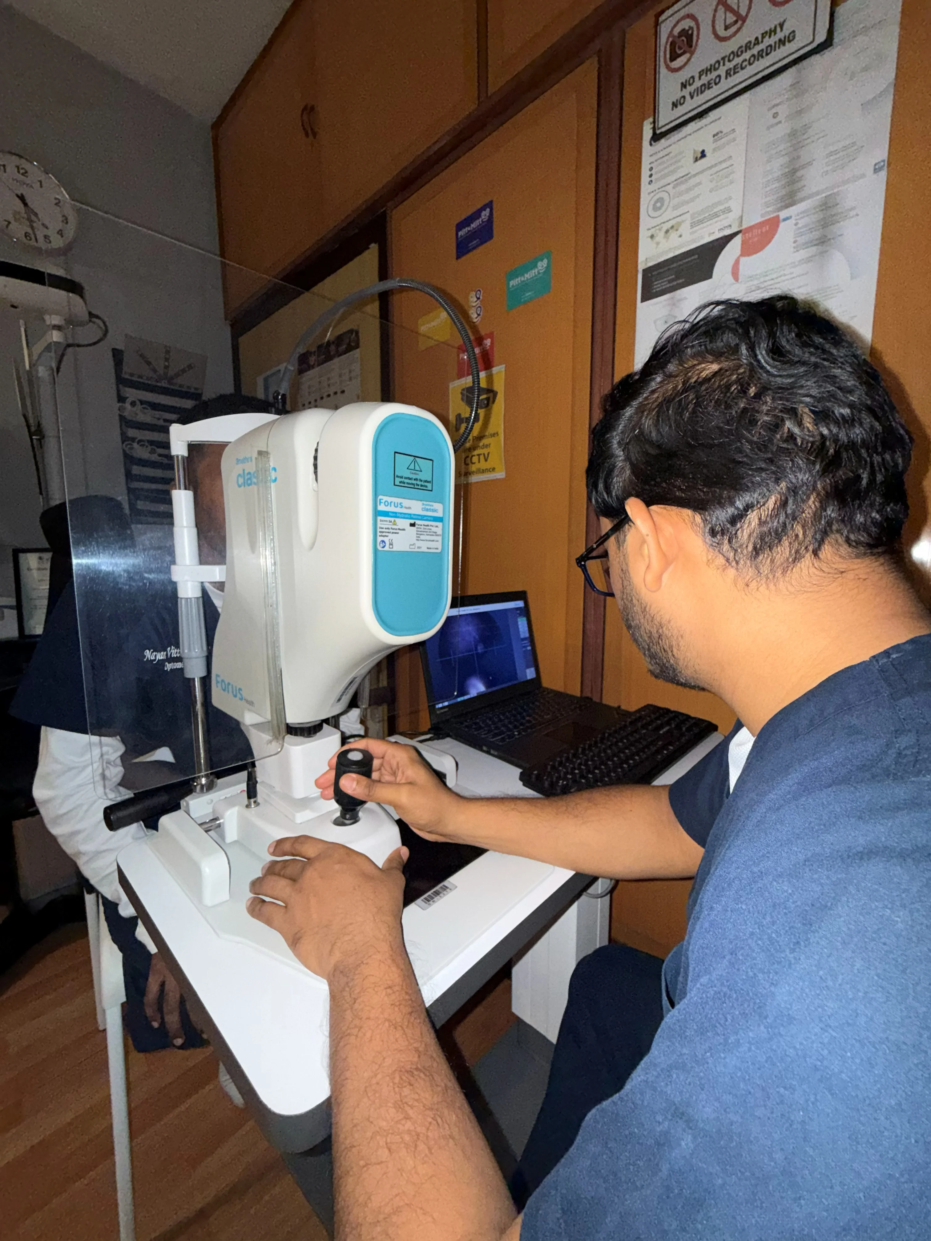 Caring Vision Therapy Ashok Nagar Chennai - Doctors reviewing diagnostic equipment during consultation session