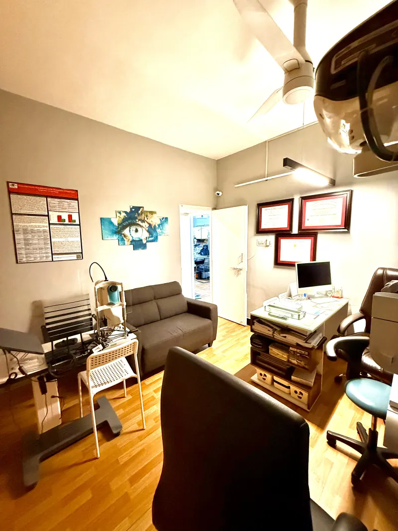 Caring Vision Therapy Ashok Nagar Chennai - Examination room with patient sofa, diagnostic instruments and certificates
