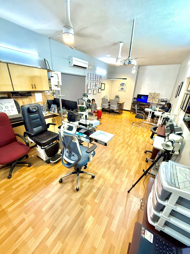 Caring Vision Therapy Ashok Nagar Chennai - Full clinical floor overview with multiple diagnostic chairs, examination equipment and therapy stations