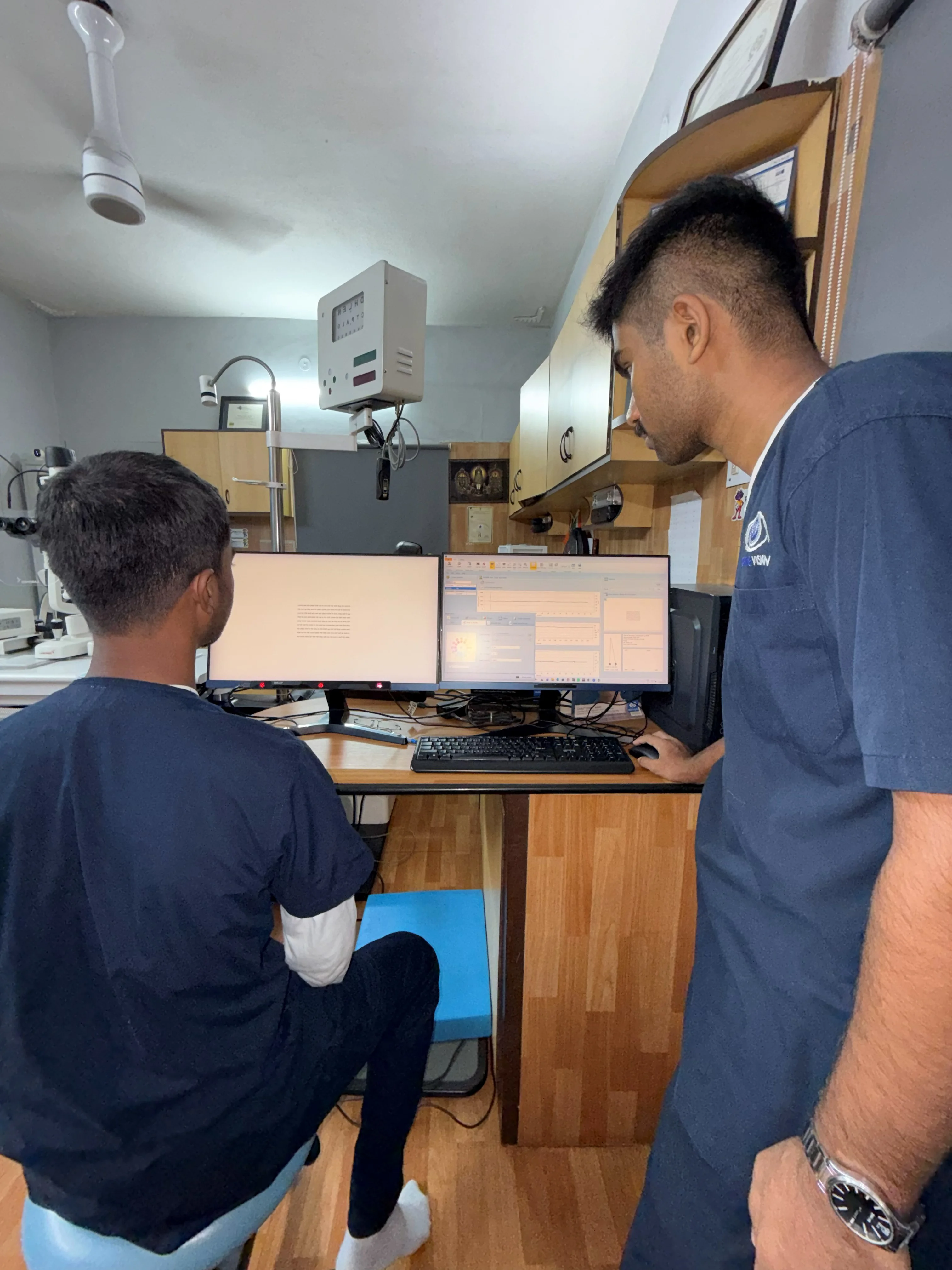 Caring Vision Therapy Ashok Nagar Chennai - Therapist at multi-monitor computerized vision therapy workstation
