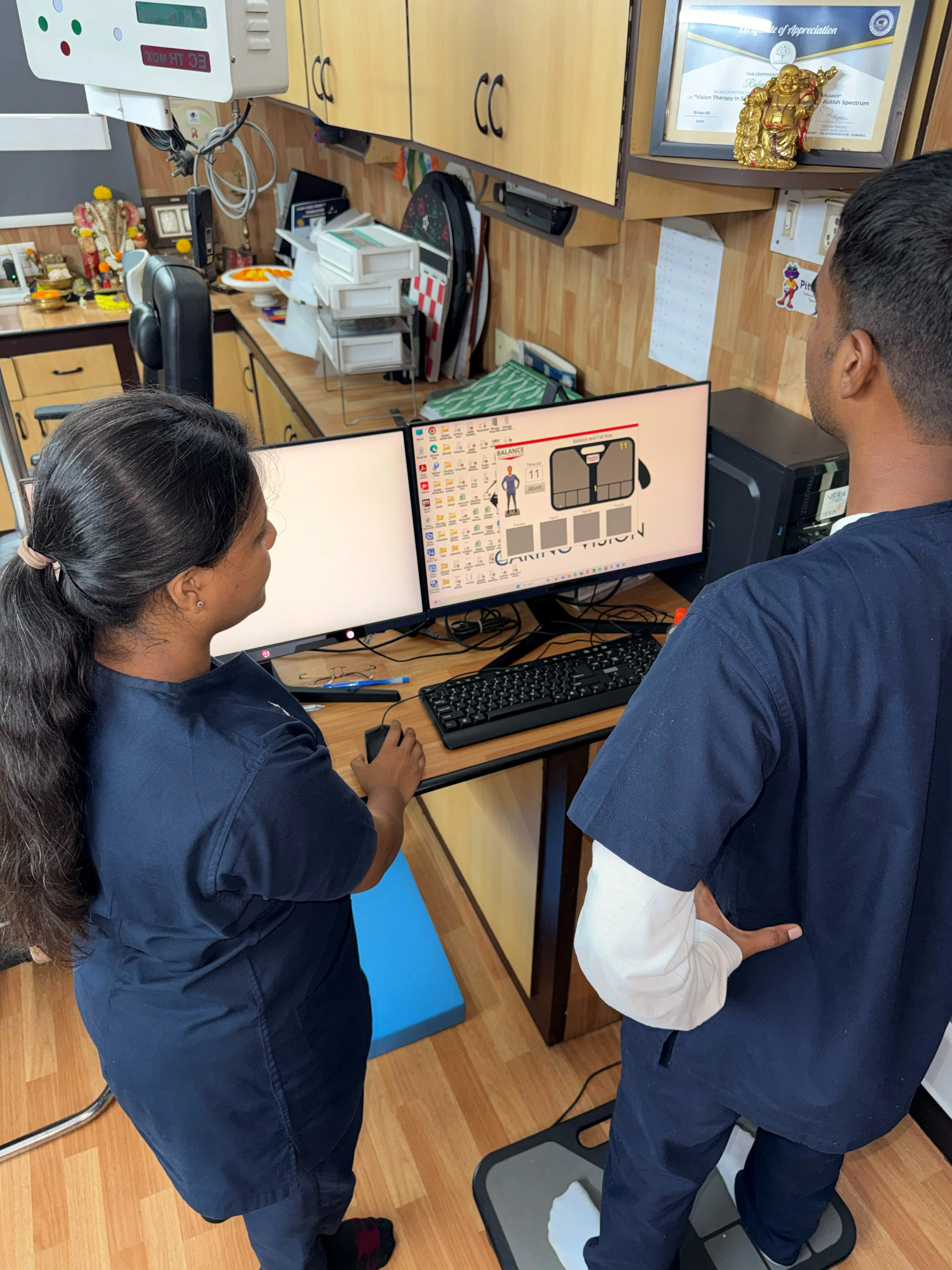 Caring Vision Therapy Ashok Nagar Chennai - Therapist conducting near vision reading chart assessment with patient