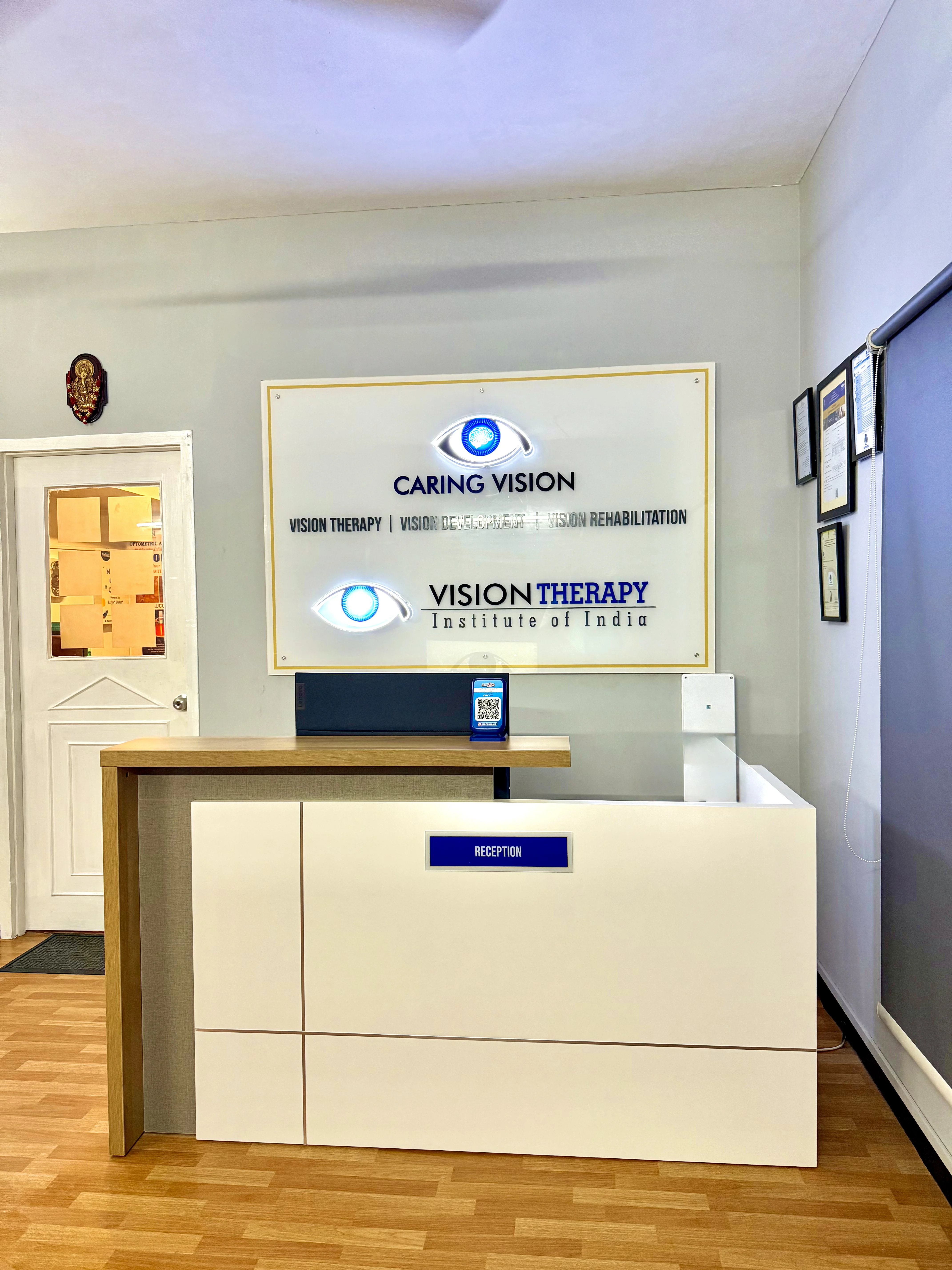 Caring Vision Therapy Ashok Nagar Chennai – Reception desk with Caring Vision and Vision Therapy Institute of India branding