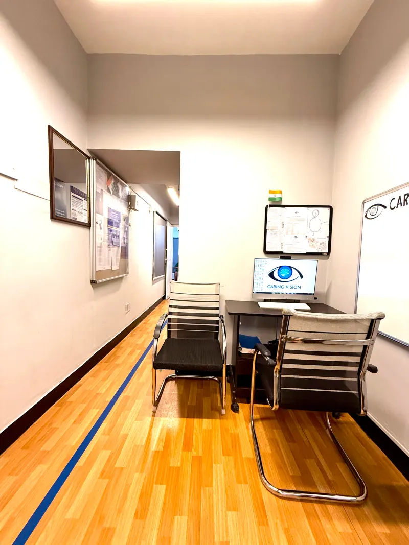 Caring Vision Therapy Ashok Nagar Chennai - Vision assessment workstation with Caring Vision branded monitor and whiteboard