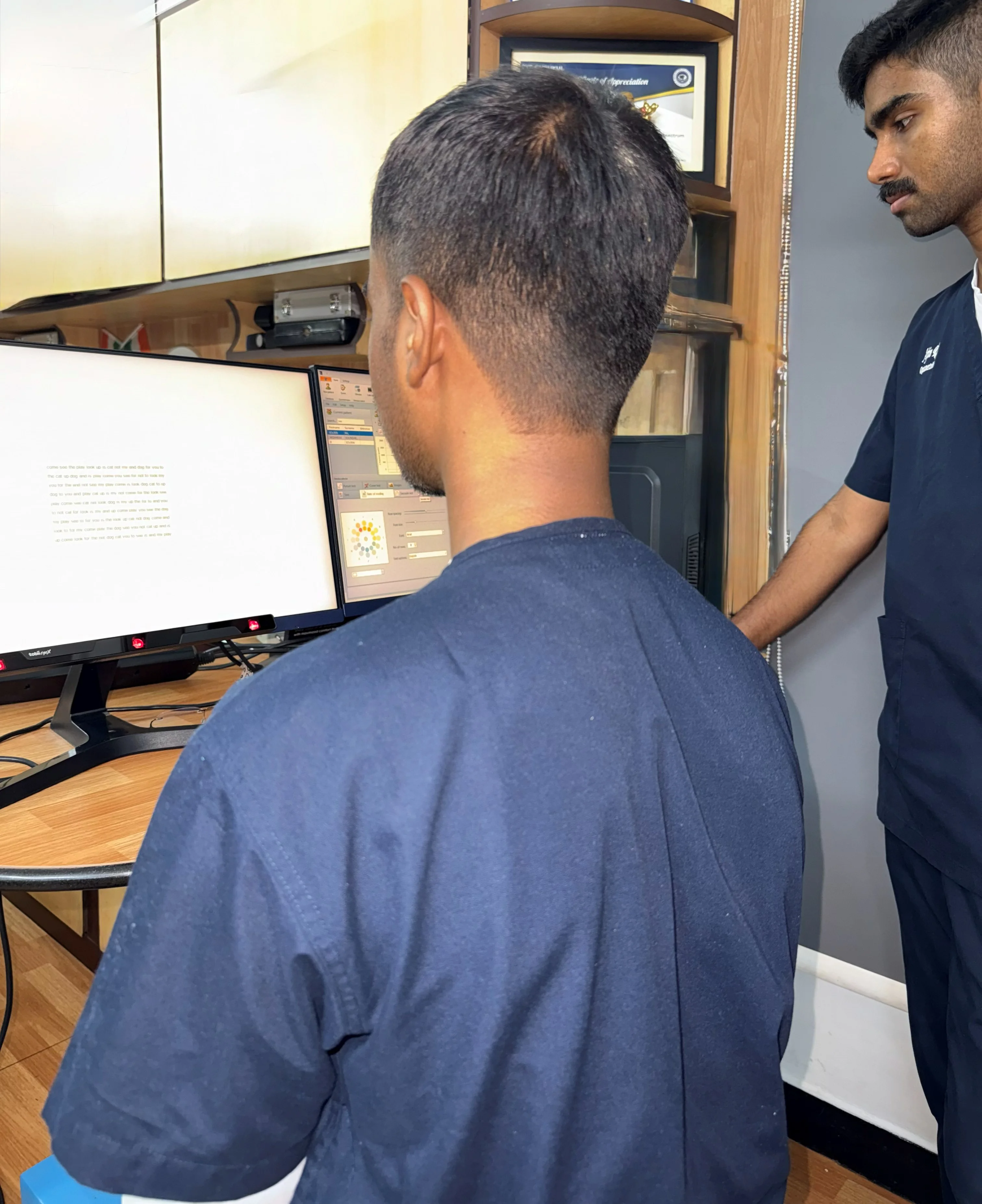 Caring Vision Therapy Ashok Nagar Chennai - Wide view of multi-monitor vision therapy workstation setup
