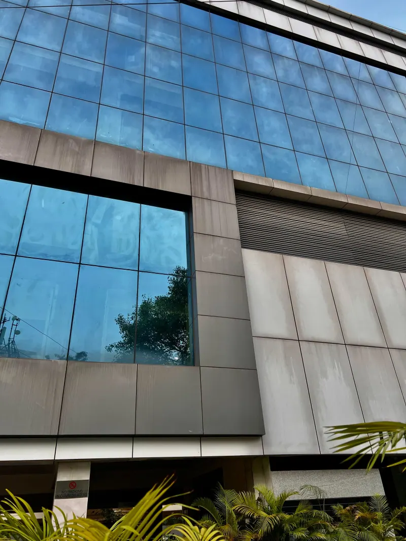 Caring Vision Therapy Hyderabad - Modern glass-facade clinic building exterior