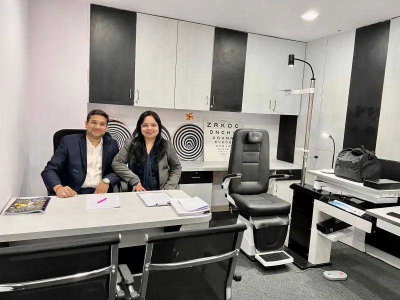 Caring Vision Therapy Hyderabad - Doctor's consultation room with Snellen eye chart, examination chair and clinical desk