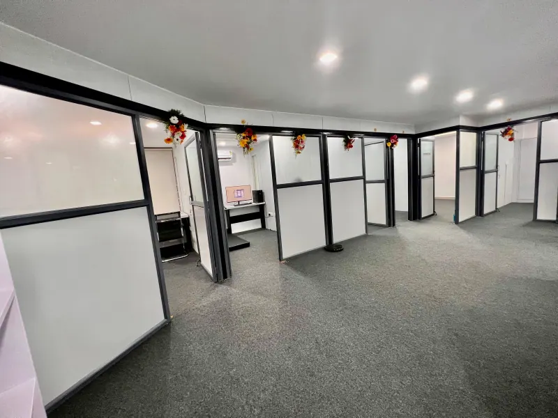 Caring Vision Therapy Hyderabad - Full therapy floor overview with multiple glass-partitioned treatment rooms