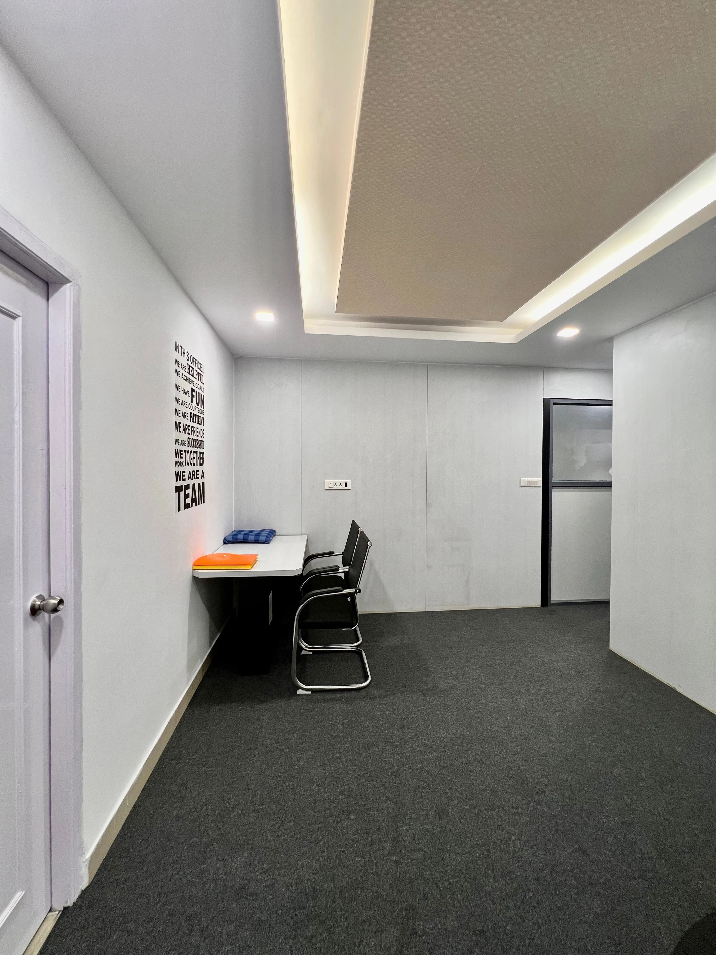 Caring Vision Therapy Hyderabad – Therapy and training room with motivational wall and modern workspace