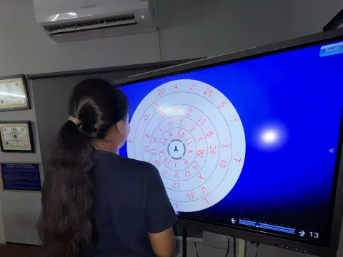 Child following a visual tracking target on a screen during vision therapy at Caring Vision Therapy, Chennai