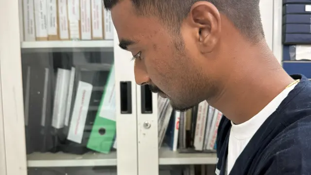 Clinician reviewing a patient progress report at Caring Vision Therapy
