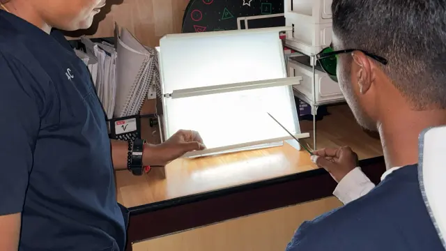 Clinician assessing eye movements during a vision therapy session at Caring Vision Therapy